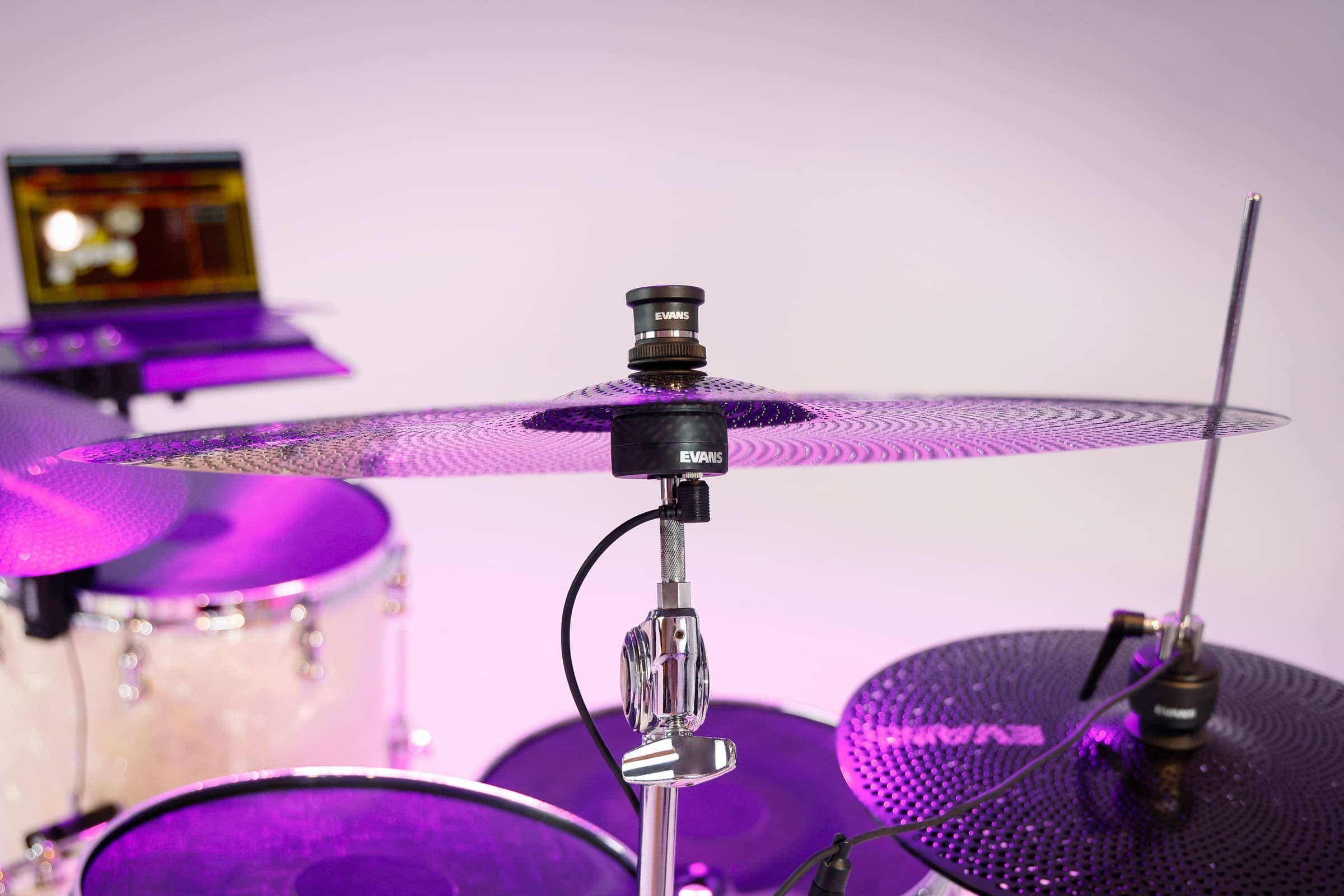 A cymbal and hi-hat fitted with Sensory Percussion sensors, connected to a laptop running the software