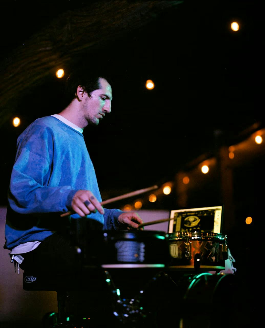 a photo of Brin performing live with Sensory Percussion