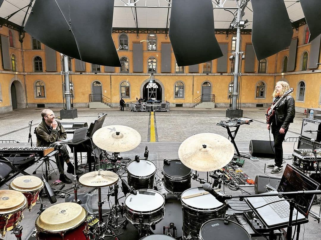 A photo from behind the drumset showing drums with sensors attached