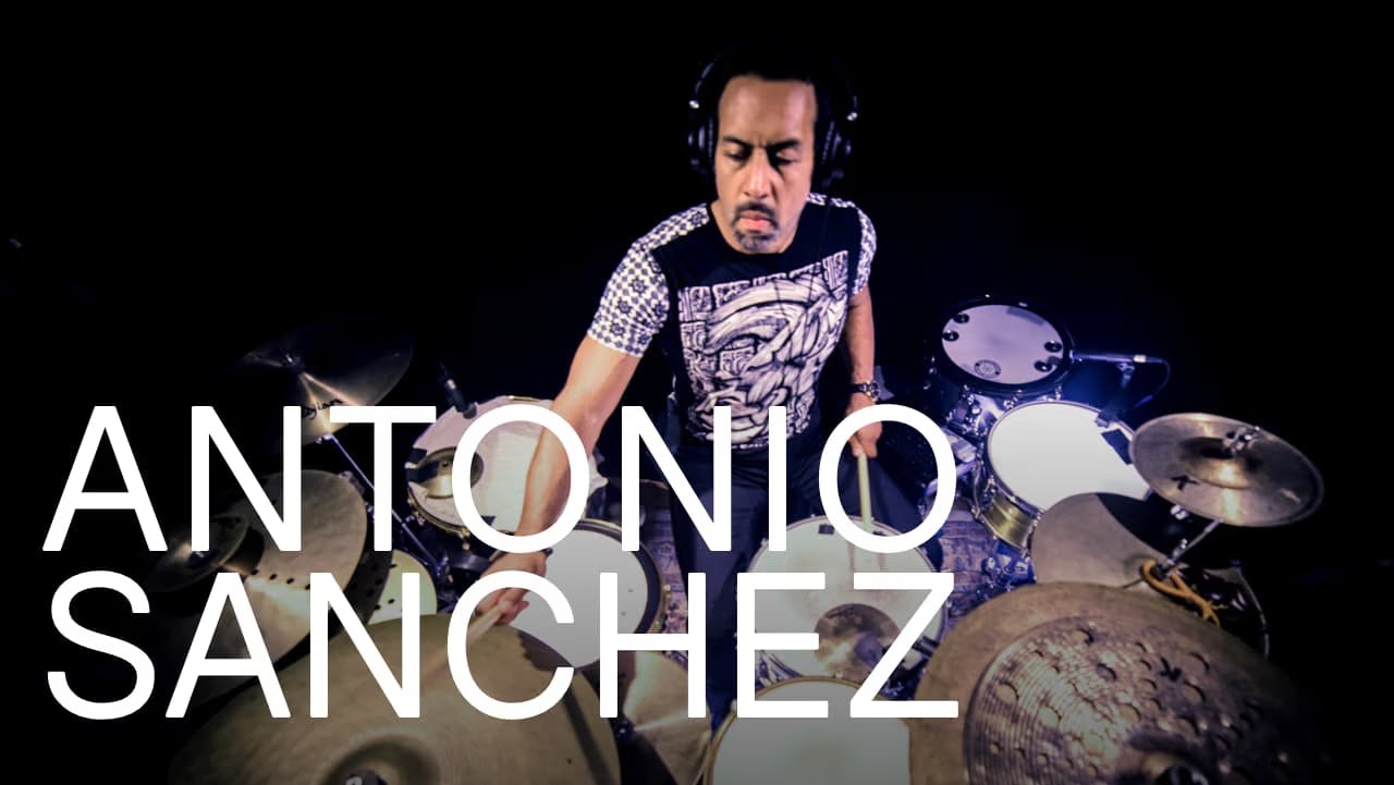 A photo of Antonio Sanchez playing a hybrid drum set with Sensory Percussion