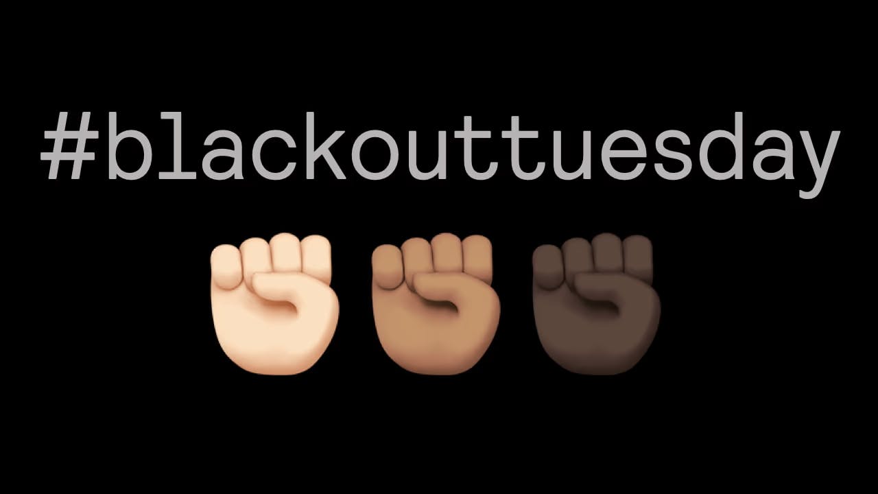 The hashtag BlackOutTuesday with three emoji fists below it