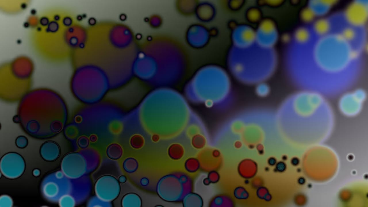 An image of bubbles of different colors like a closeup of an oily surface