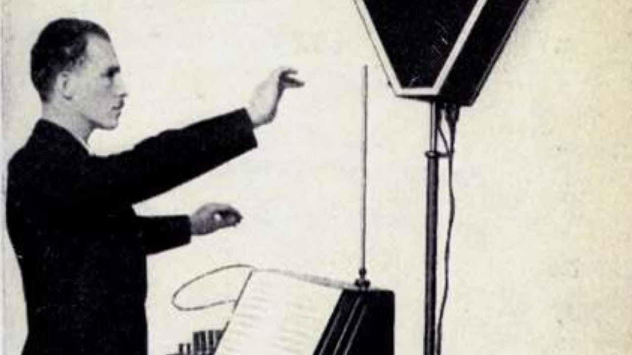 A photo of Leon Theremin playing his instrument, the Theremin